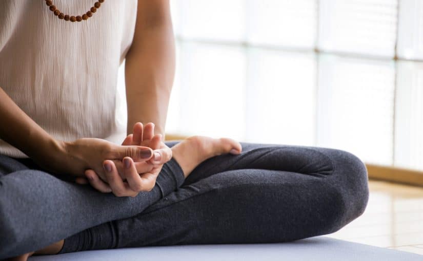 A woman practicing Yoga