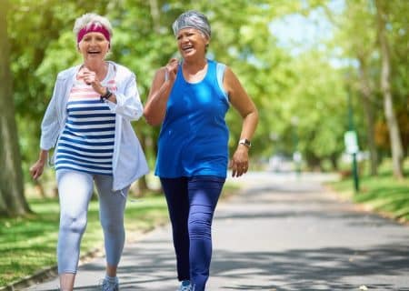 Two senior women walking for chronic pain