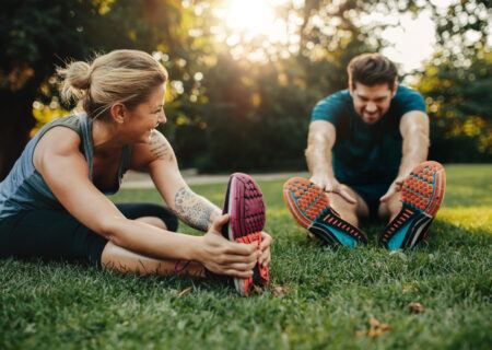 Couple stretching for their workout