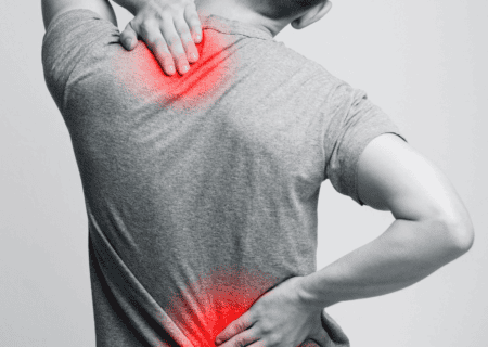 Person experiencing shoulder and lower back pain, highlighting areas of discomfort.